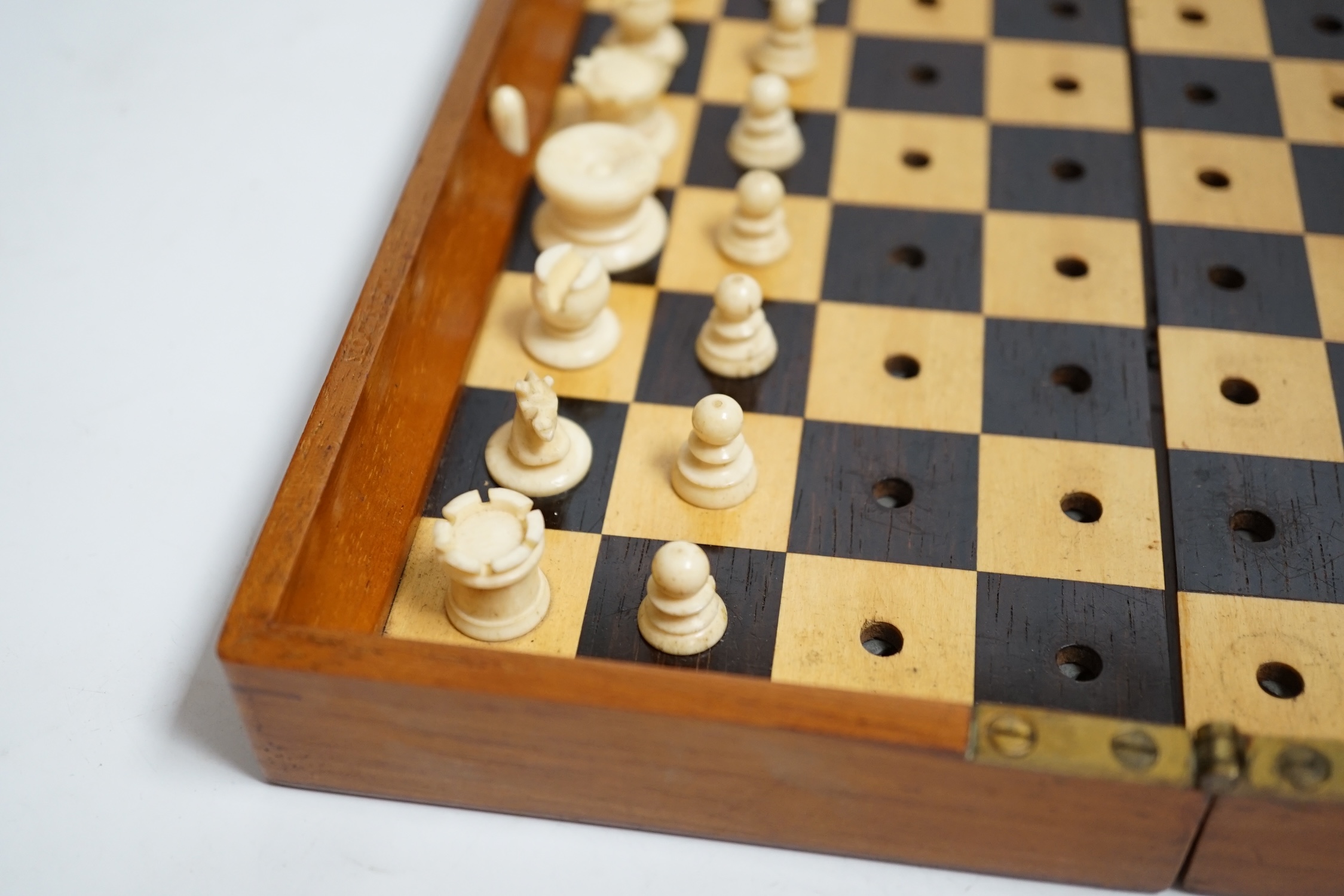 A Jaques in Statu Quo travelling chess set with bone pieces, leather slip case. Condition - fair